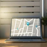 GPS fleet tracking dashboard on a laptop for a small business with delivery vans.